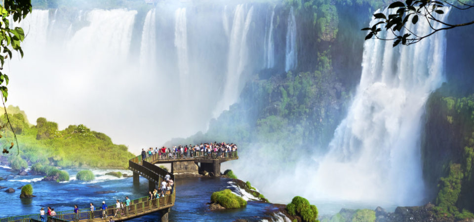 Tourists at Iguazu Falls, one of the world's great natural wonders, on the border of Brazil and Argentina.